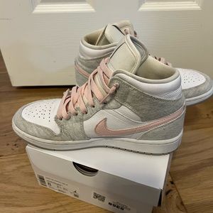 Nike Jordan’s. Pink and gray Jordan 1 MID SE. Iron Ore Atmospheric White